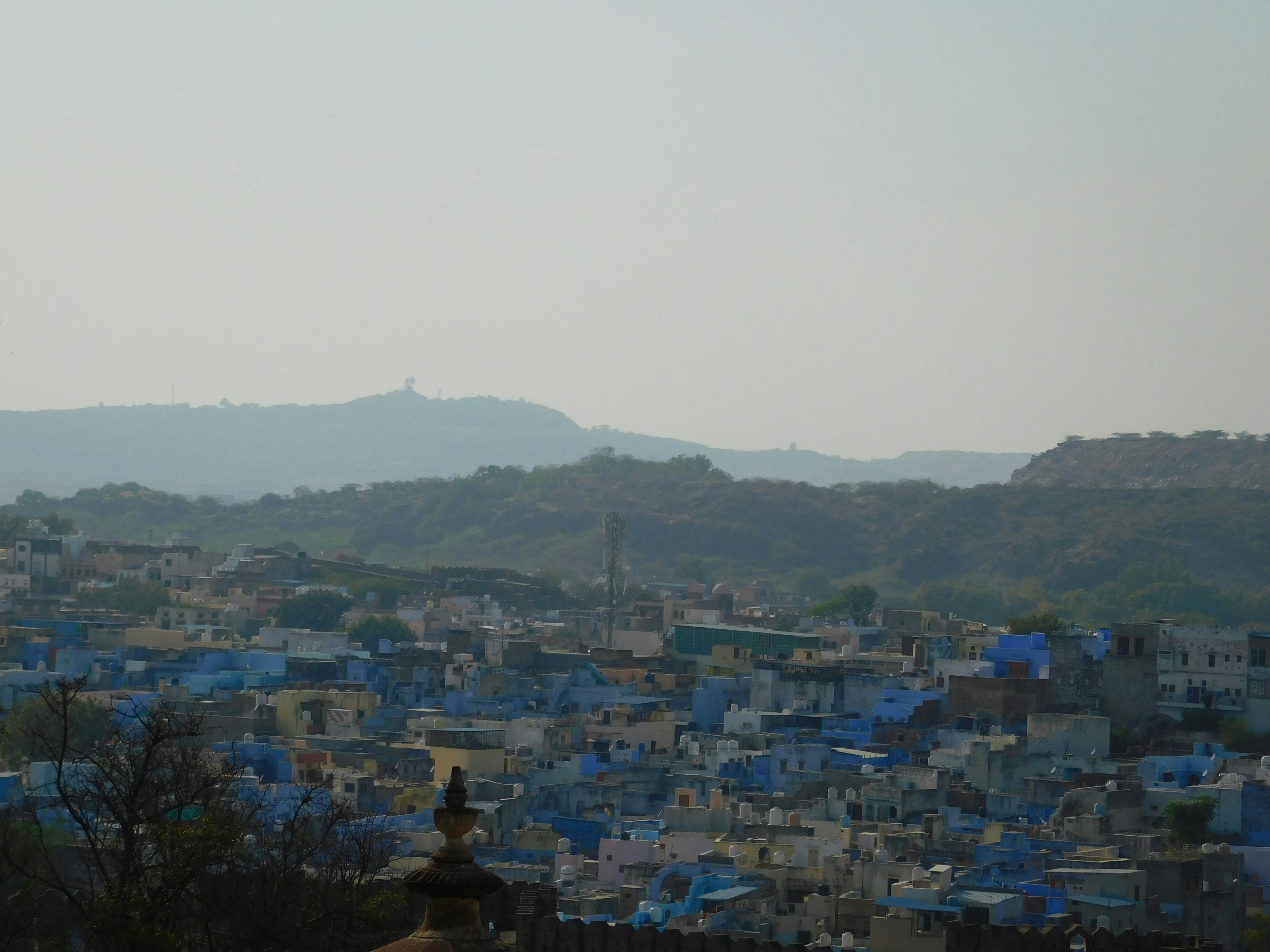 NRIs reviewing property blueprints at a real estate expo