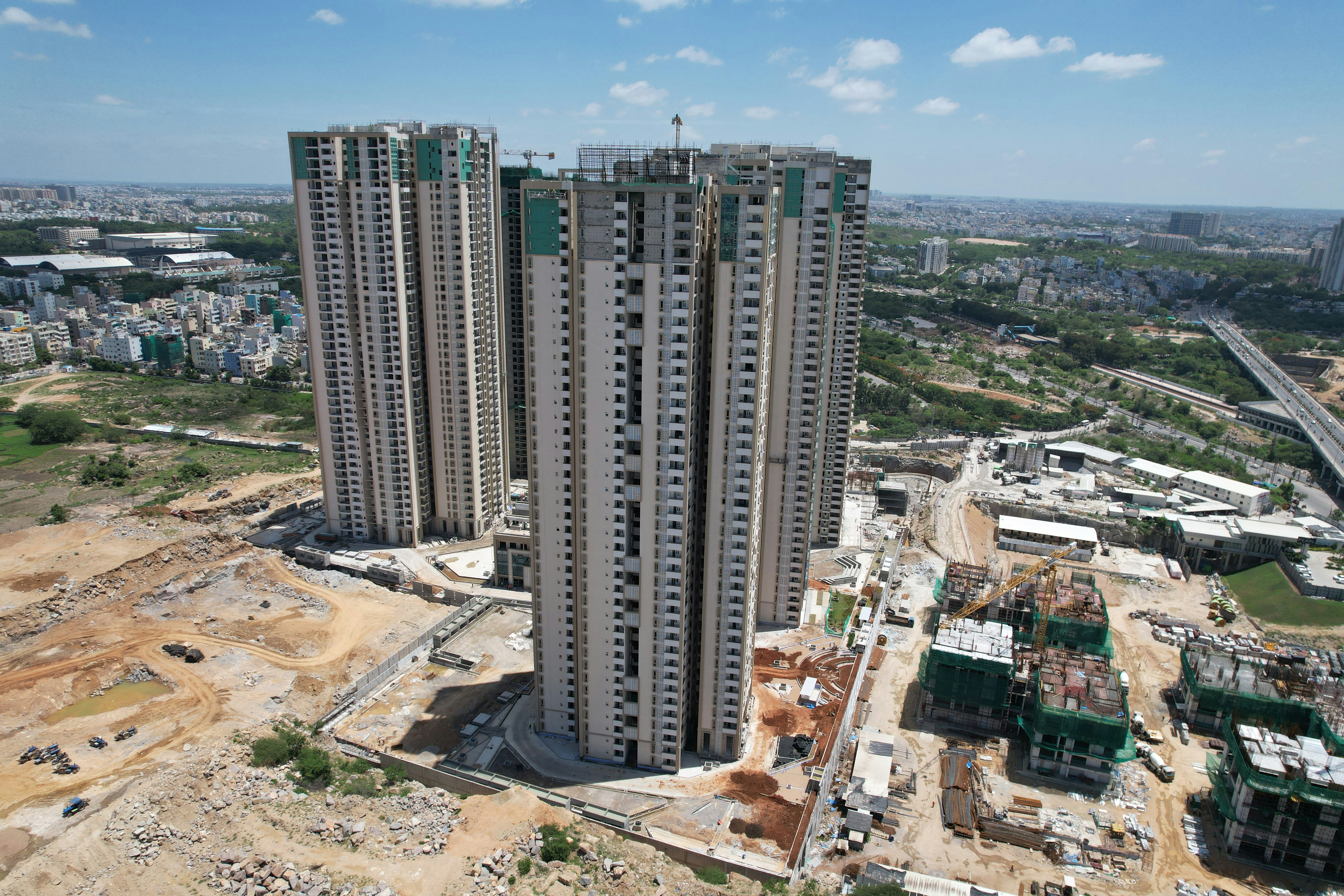 A family happily discussing their real estate investment in India