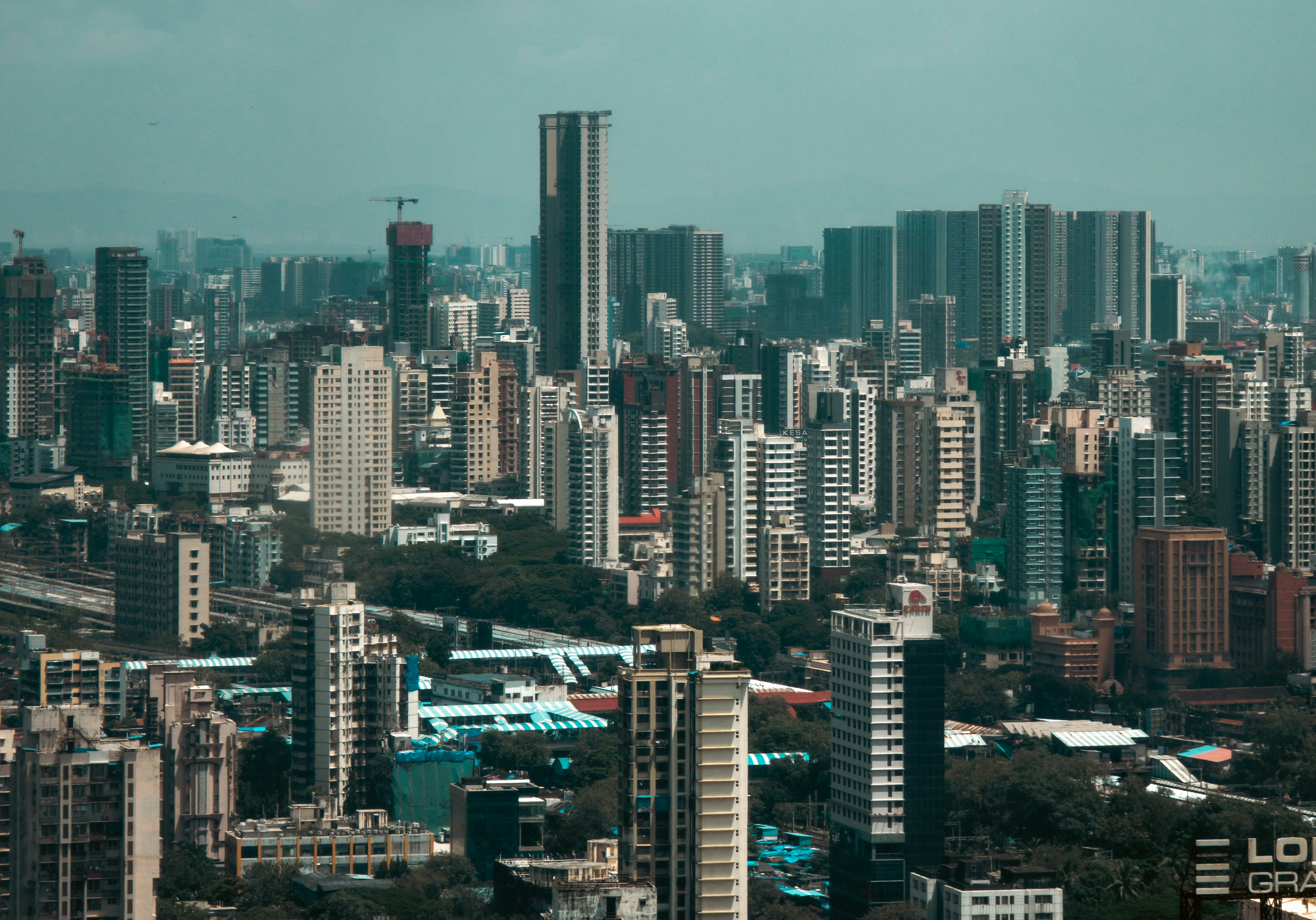 Blueprints and construction site symbolizing real estate development