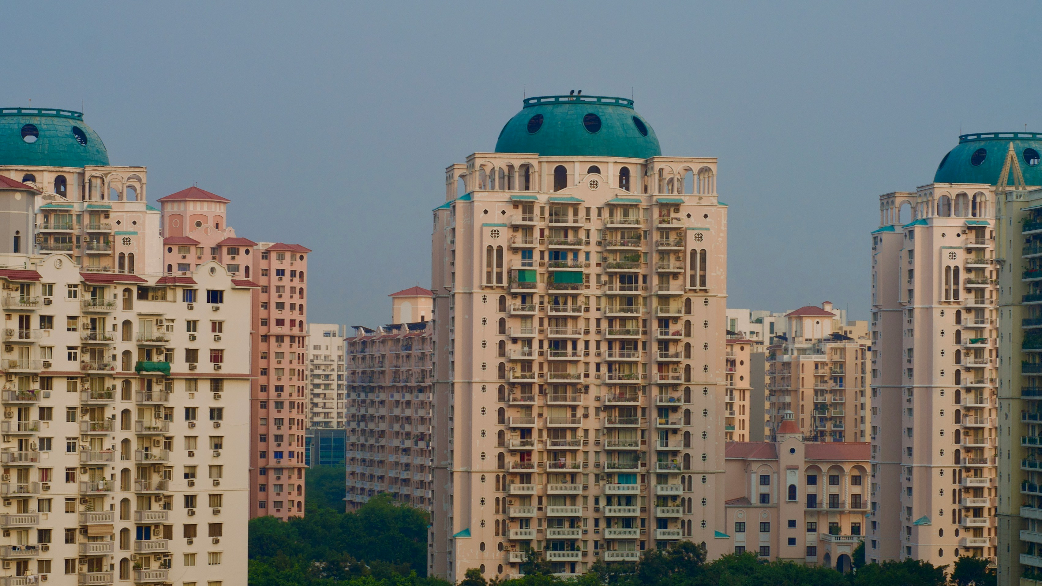 A modern apartment building Funder construction, symbolizing the challenges in the affordable housing sector.