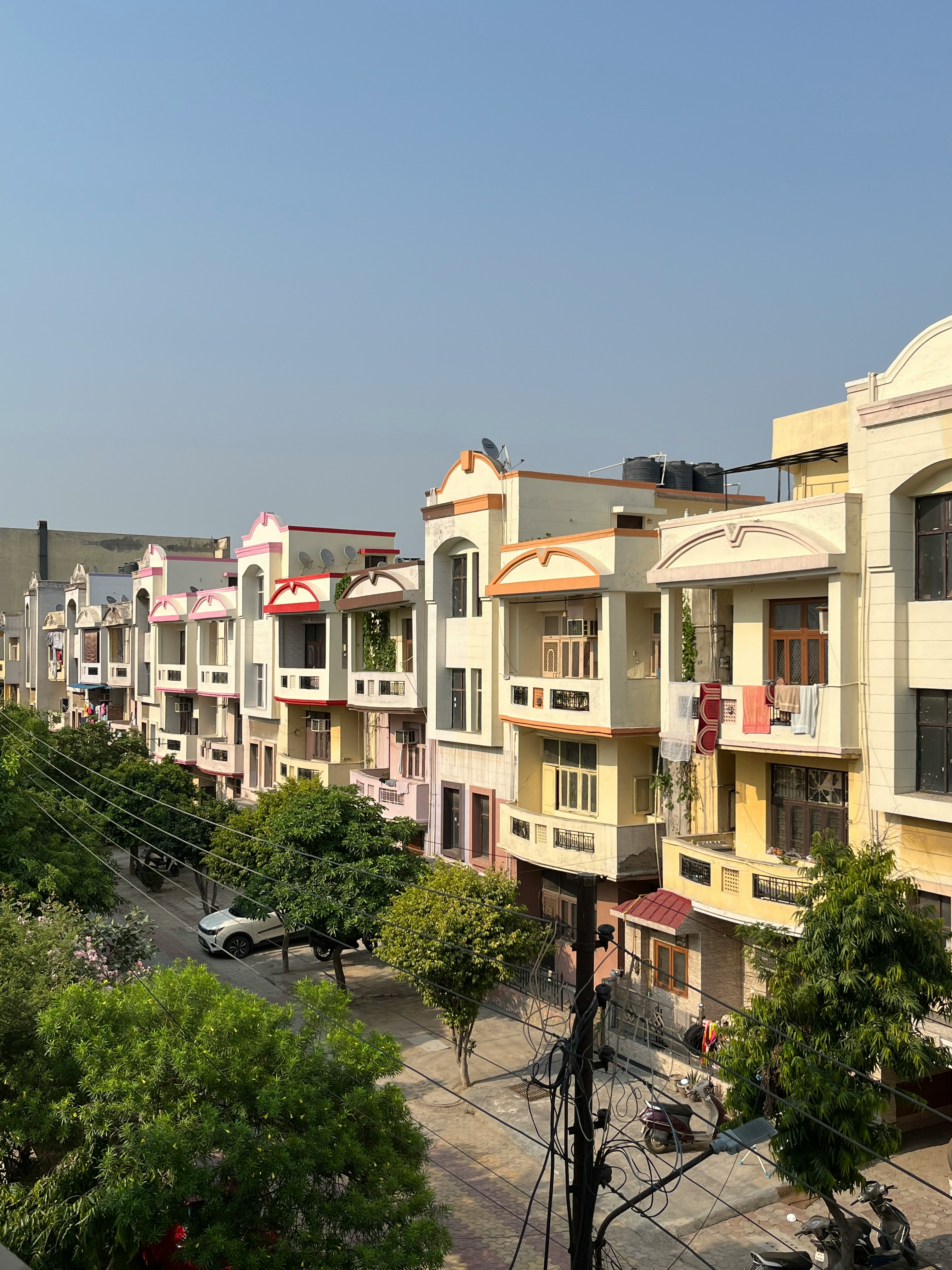 A modern apartment complex representing affordable housing in urban India.