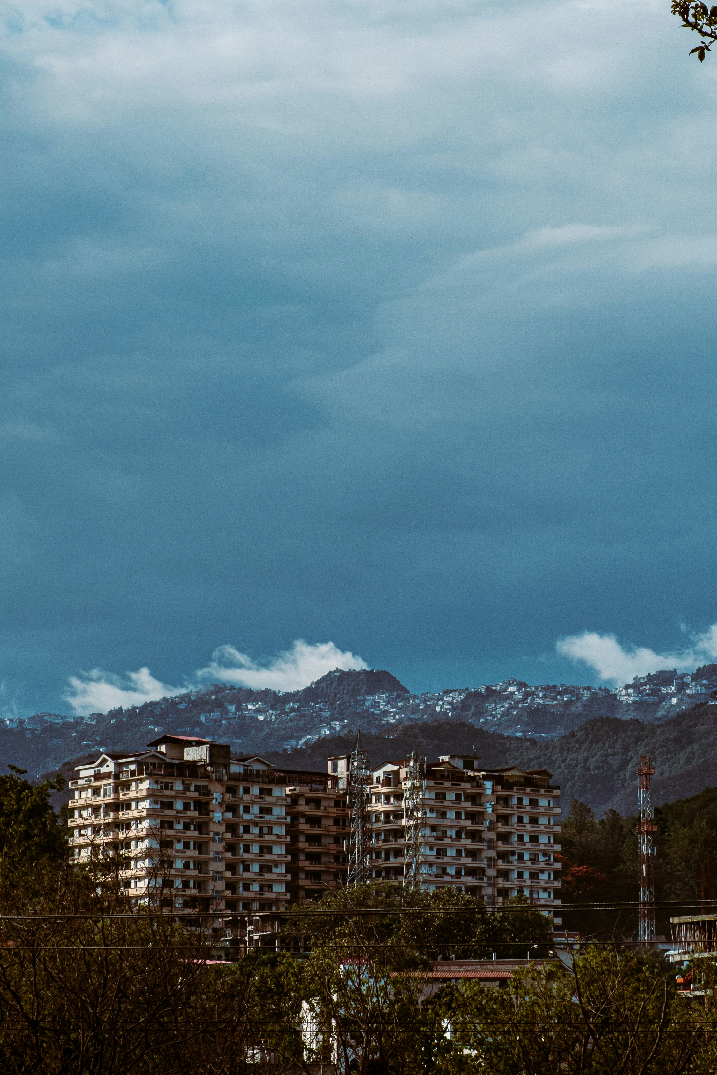 Aerial view of Dehradun city and foothills, showcasing popular residential neighborhoods