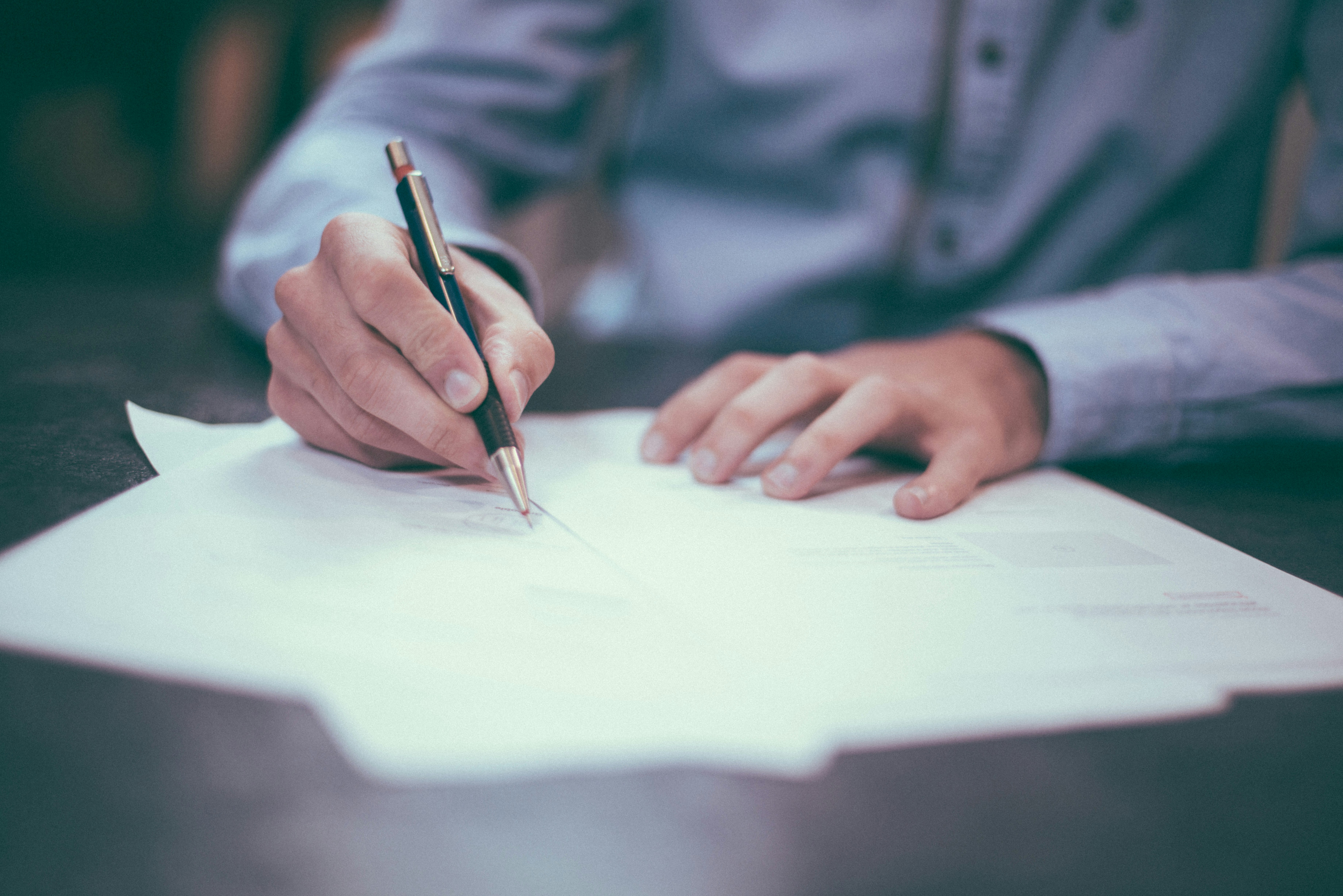 Signing a deed to add a co-owner to property in India