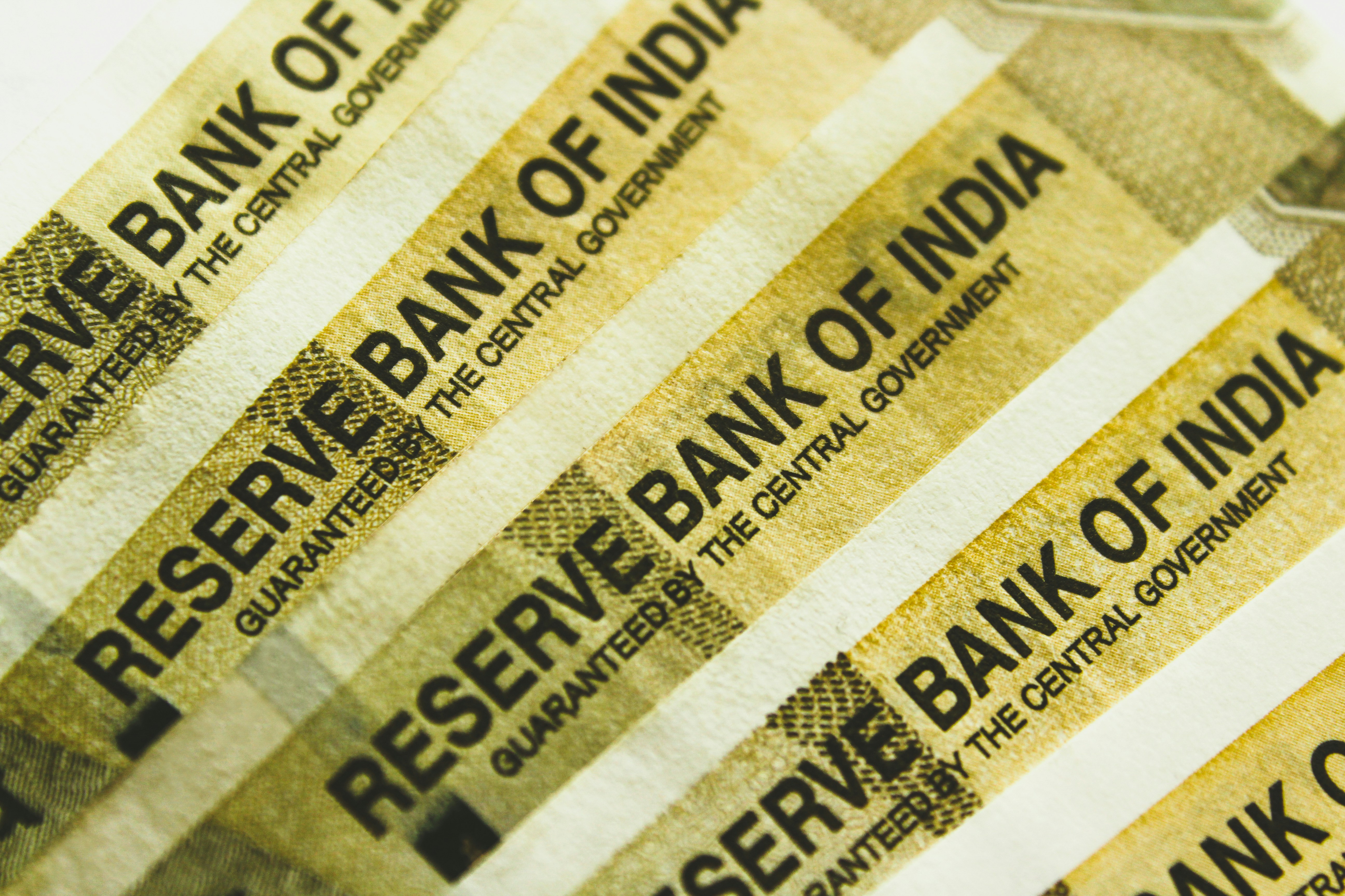 Indian property documents and a drafted will on a desk